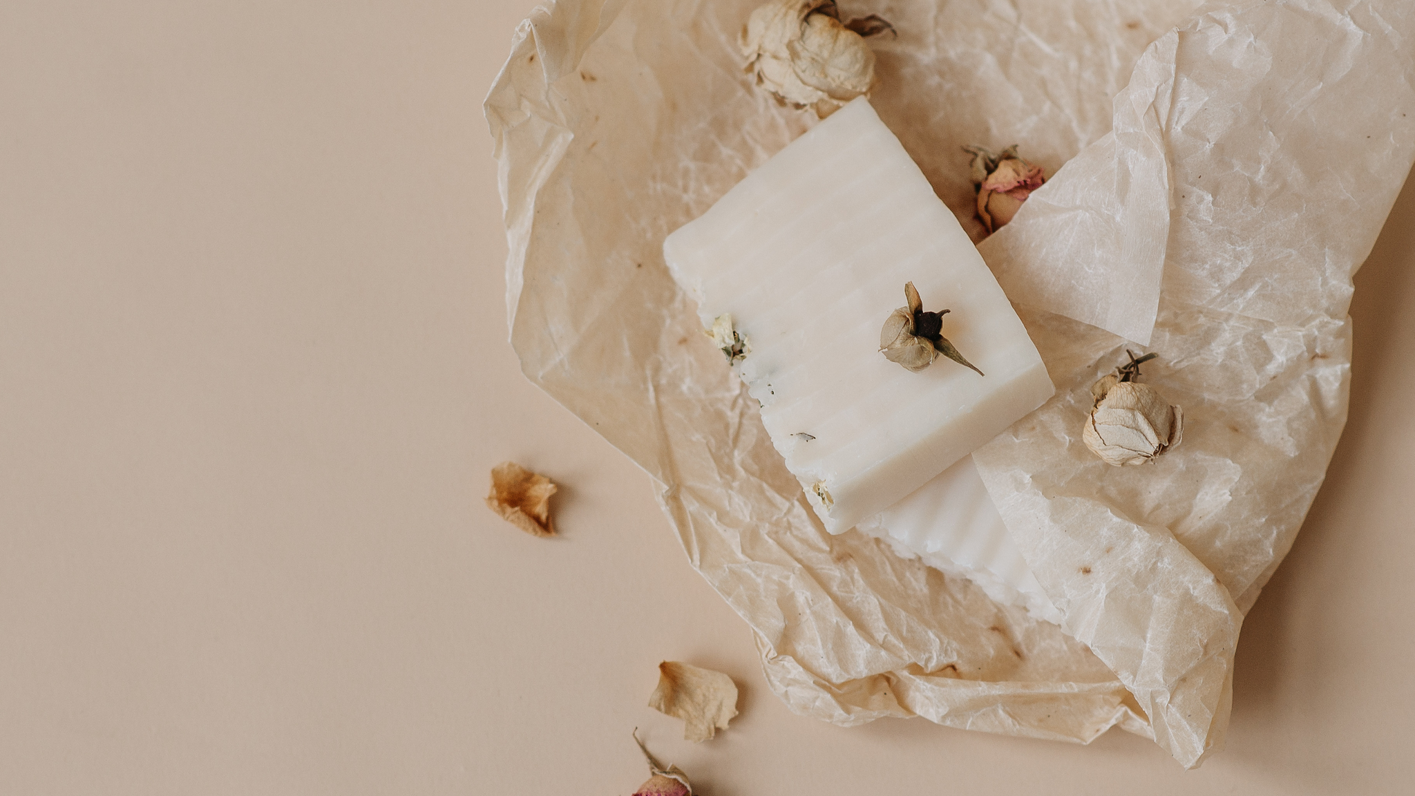 Paper and dried flowers on a neutral background, cover image for blog 'Quieting Your Inner Critic: A Gentle 3-Step Approach with ACT, Self-Compassion and AI'.