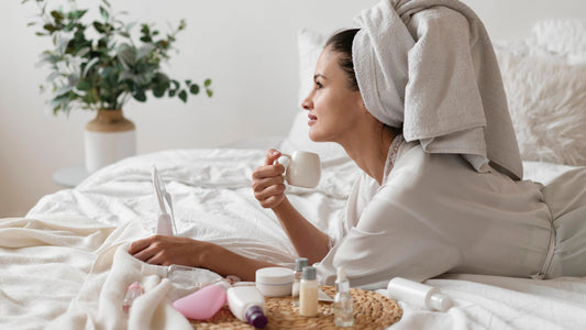 A woman enjoying a calm morning coffee in bed after burnout recovery — psychologist-designed ACT and self-compassion morning routine by Talk2Tessa, promoting gentle self-care and slow, mindful structure.