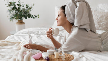 A woman enjoying a calm morning coffee in bed after burnout recovery — psychologist-designed ACT and self-compassion morning routine by Talk2Tessa, promoting gentle self-care and slow, mindful structure.