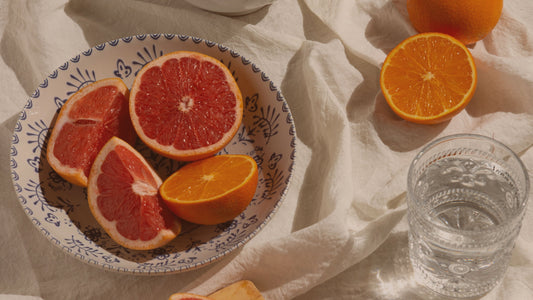 Hero image of fresh fruit and water in soft natural light, evoking calm, nourishment and emotional gentleness, used on a psychologist-written article about motivational quotes for hard days.